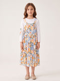 Floral jumper set on a girl, knee-covering skirt