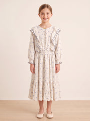 Blue floral ruffled dress on a girl, knee-covering skirt