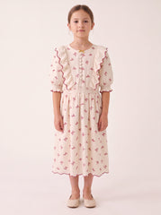 Burgundy floral ruffled dress on a girl, knee-covering skirt