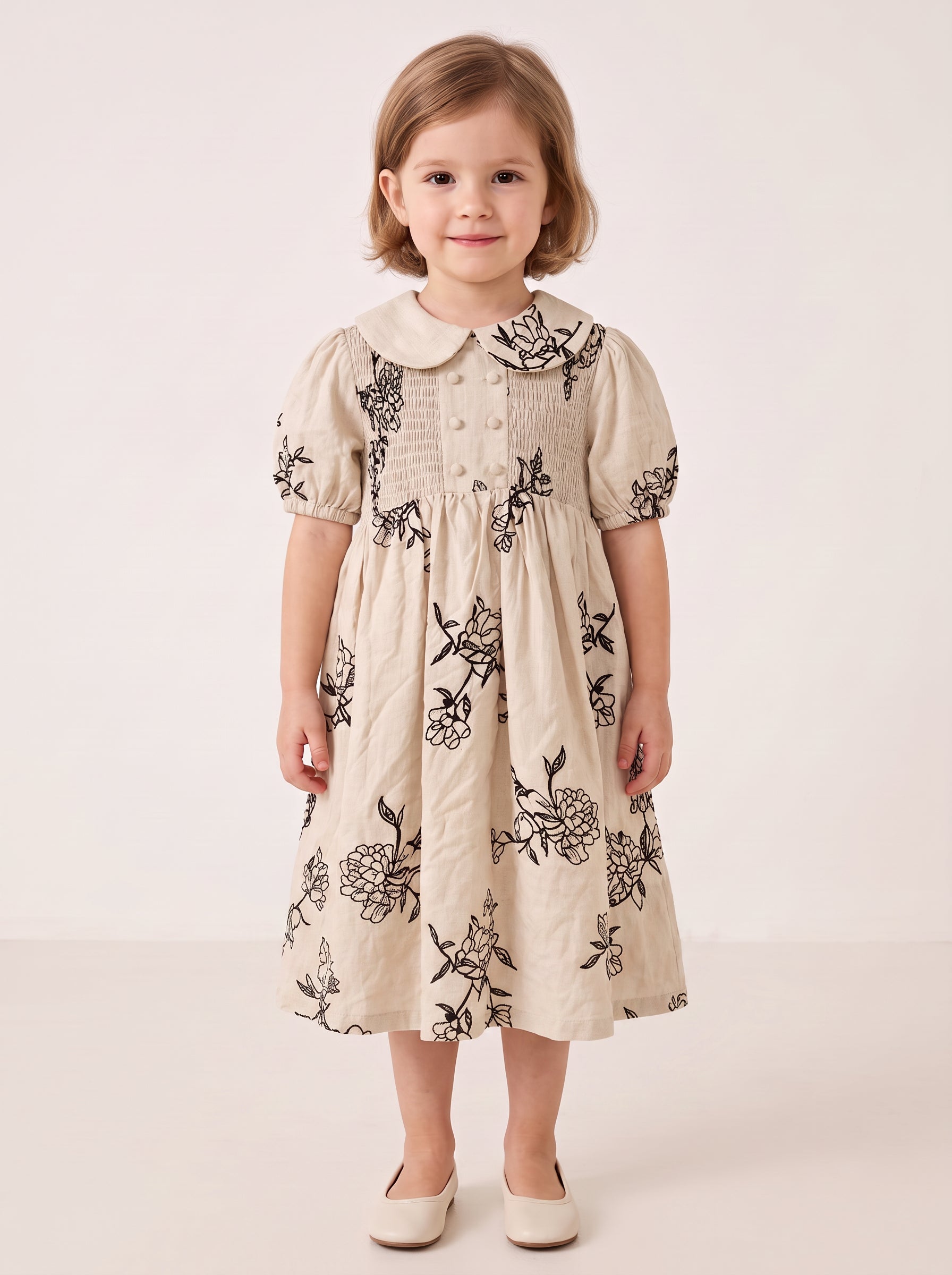 Beige floral smocked dress on a girl, knee-covering skirt
