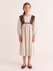 Striped crochet ruffle dress on a girl, knee-covering skirt