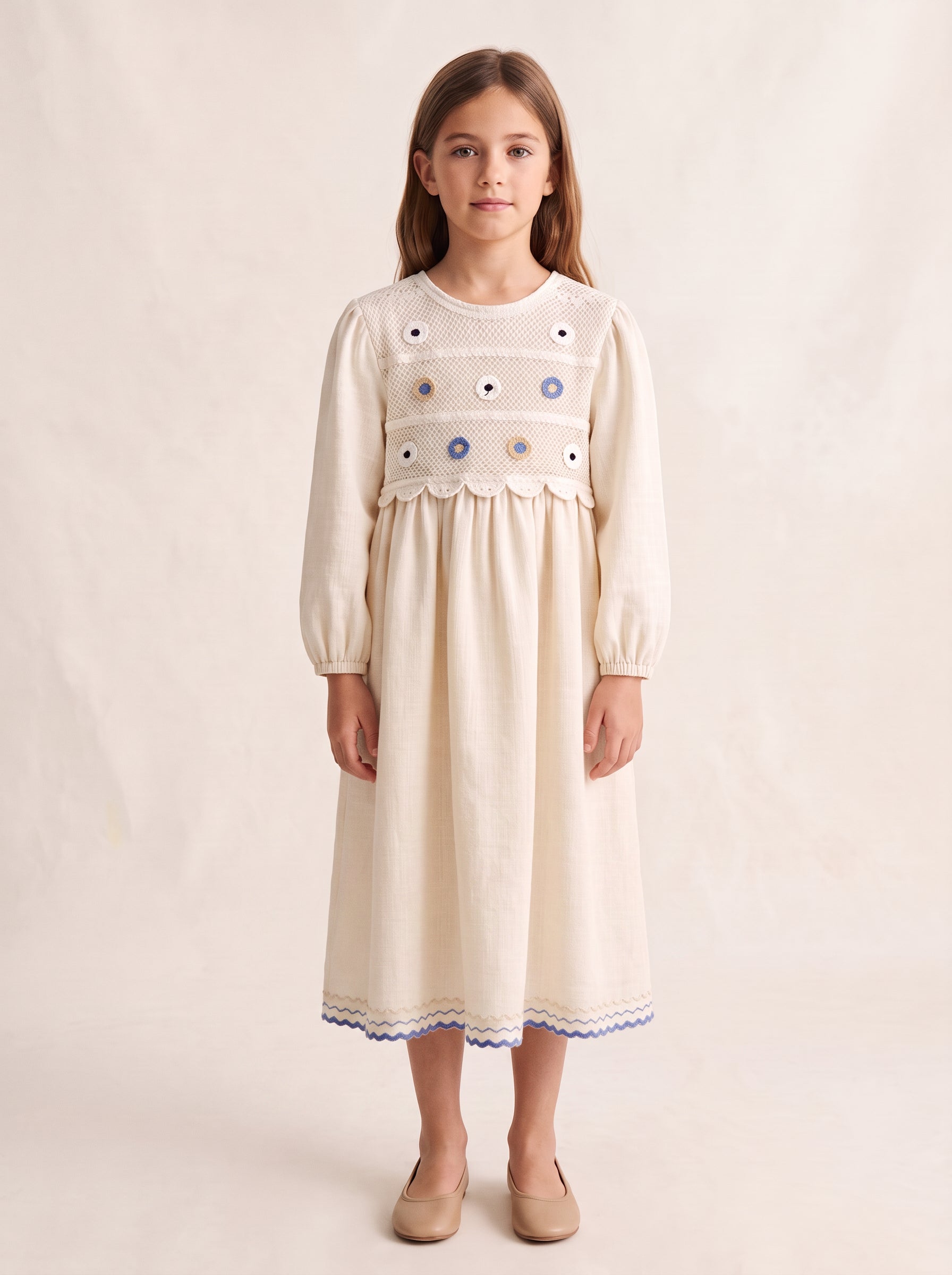 Ivory crochet-yoke embroidered dress on a girl, knee-covering skirt