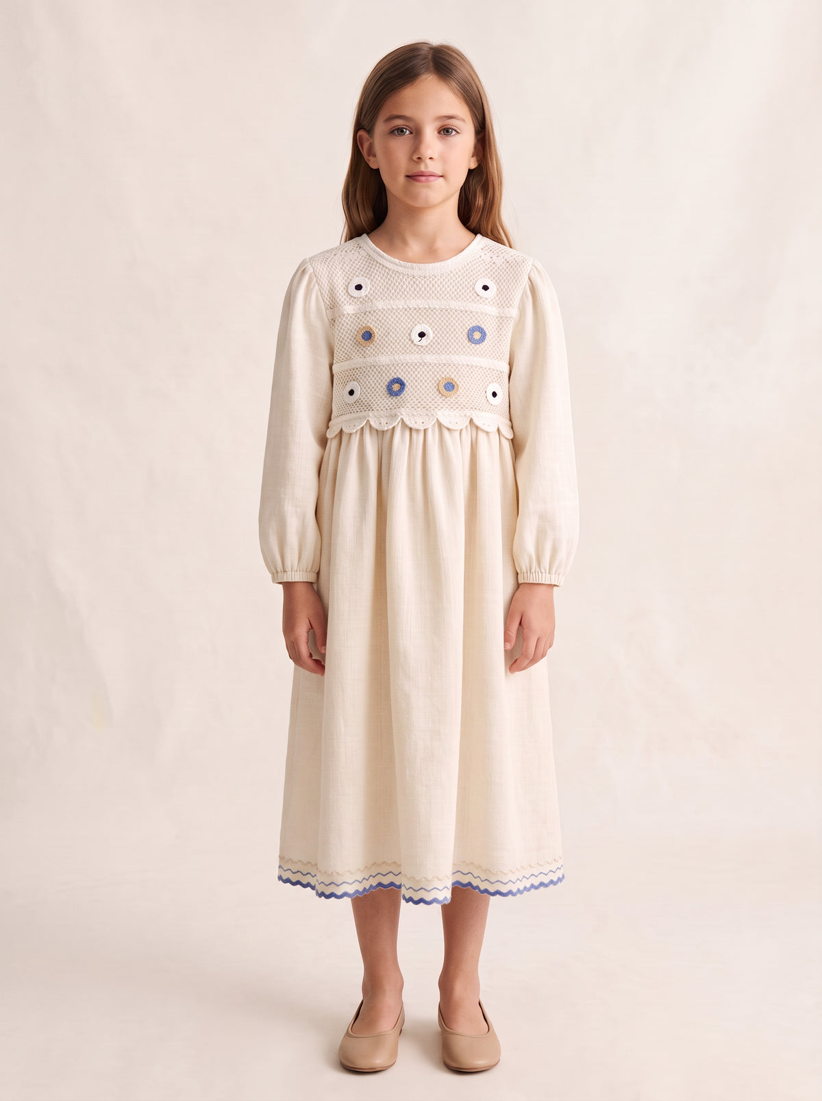 Ivory crochet-yoke embroidered dress on a girl, knee-covering skirt