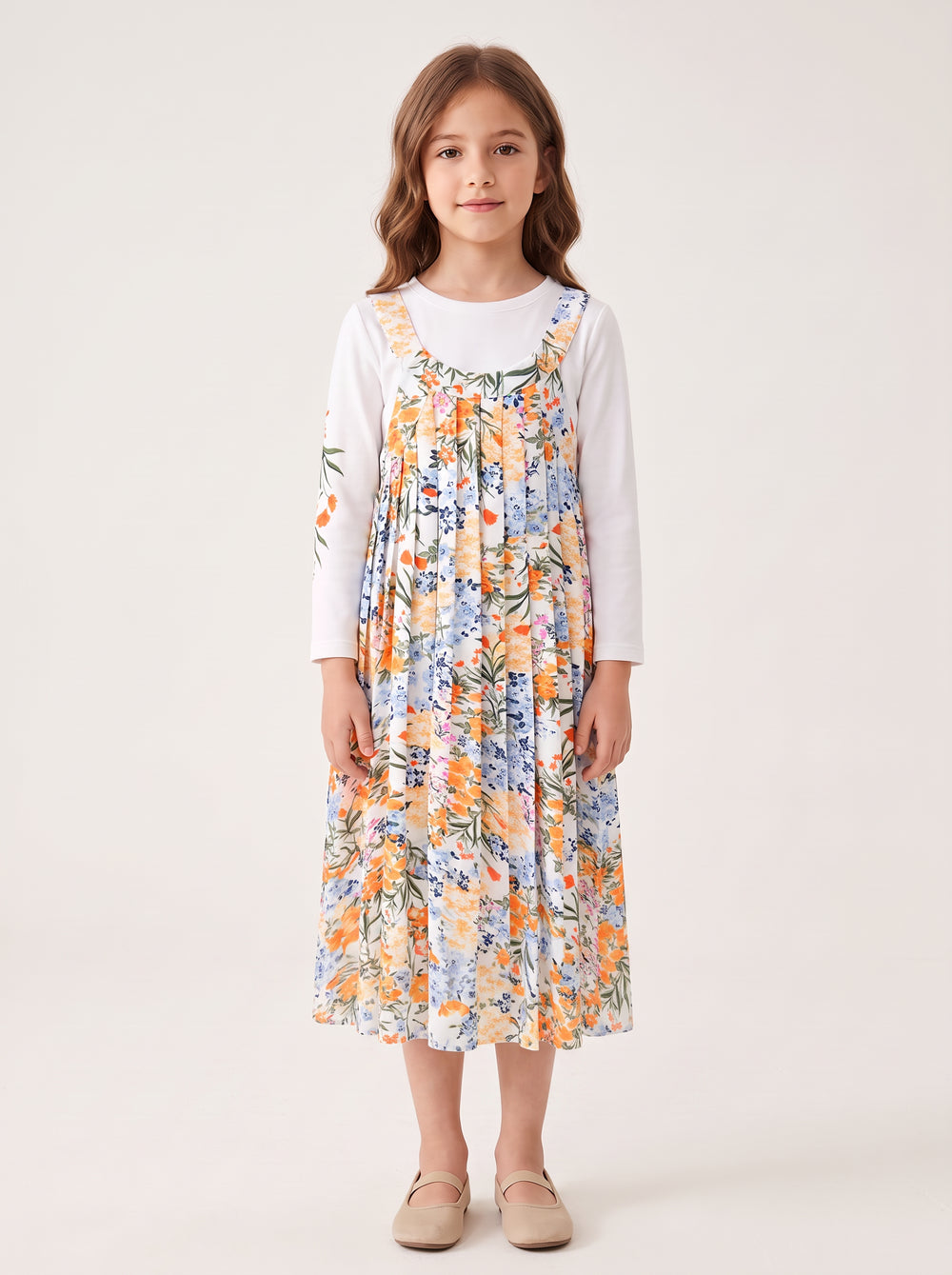 Floral jumper set on a girl, knee-covering skirt