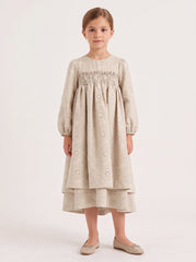 Girl modeling the beige eyelet dress, skirt covering the knees