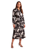 Black and white abstract print belted midi dress with long sleeves on a hair-down model
