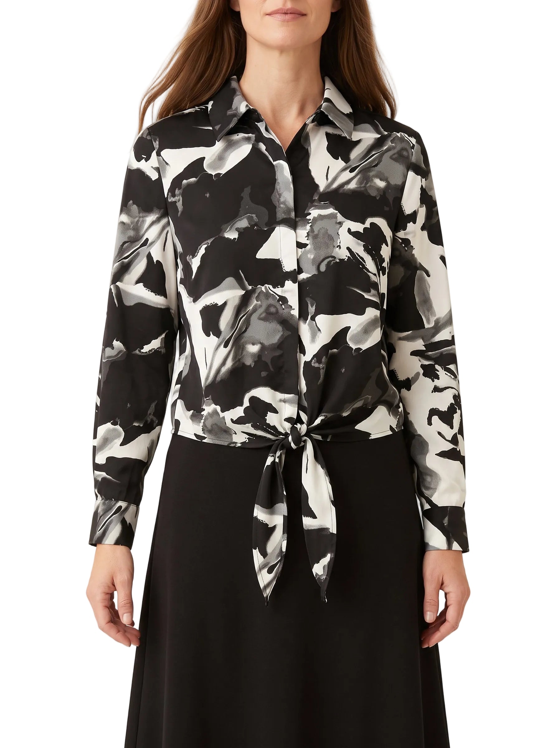 Black and white abstract-print tie-front blouse with pointed collar and long sleeves on a model