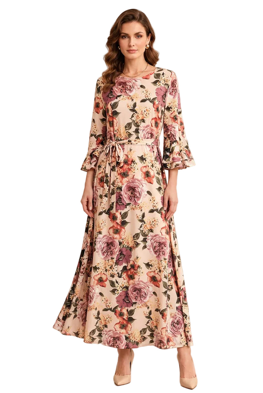 Model wearing blush floral modest maxi dress with bell sleeves and tie belt