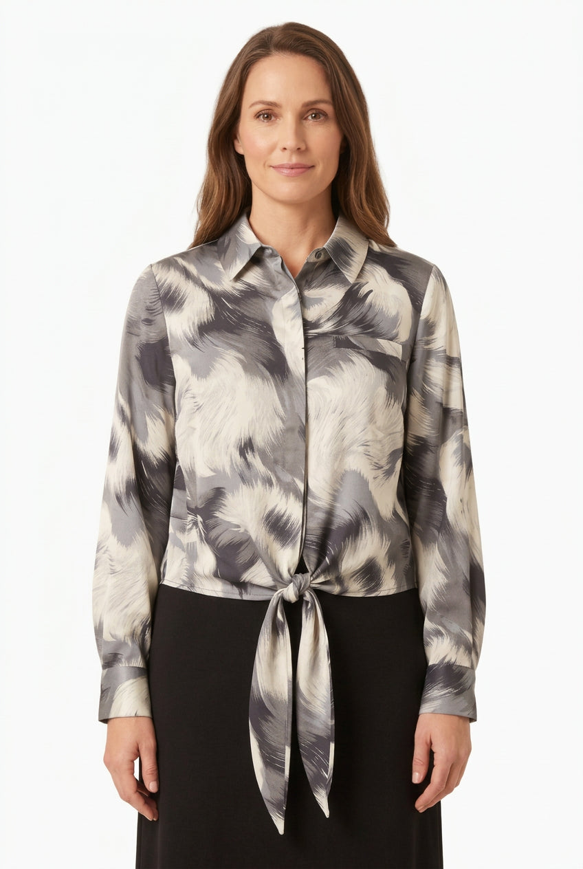 Gray feather-print tie-front blouse with pointed collar and long sleeves on a model
