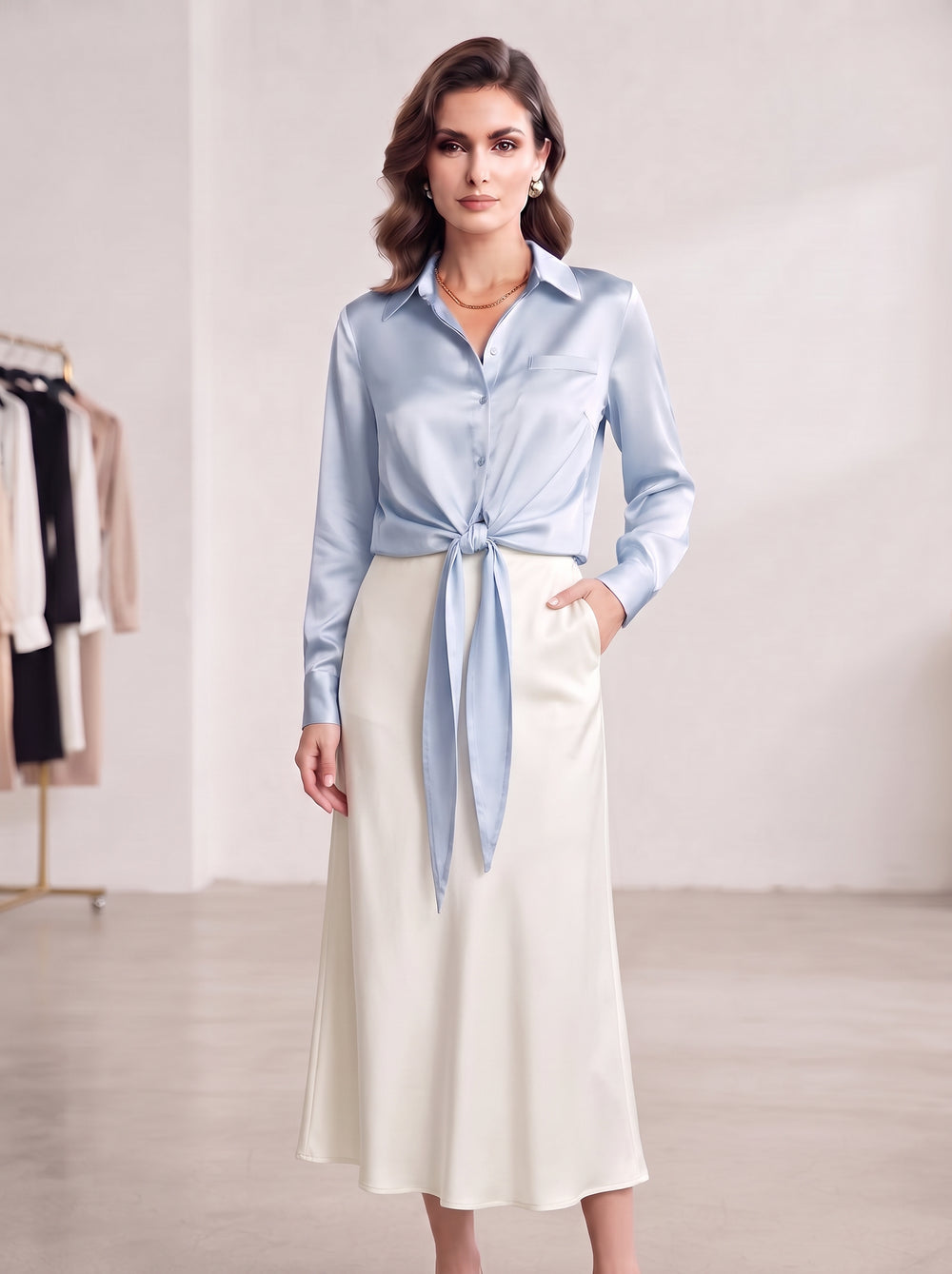 Light-blue satin blouse styled with a visible front tie
