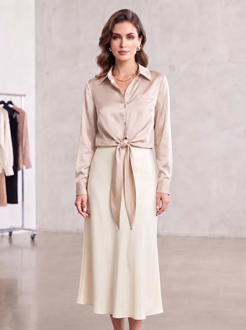 Neutral beige satin blouse styled with a visible front tie