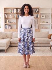 White fitted long-sleeve layering shell, Style 6657-1, tucked into blue floral skirt